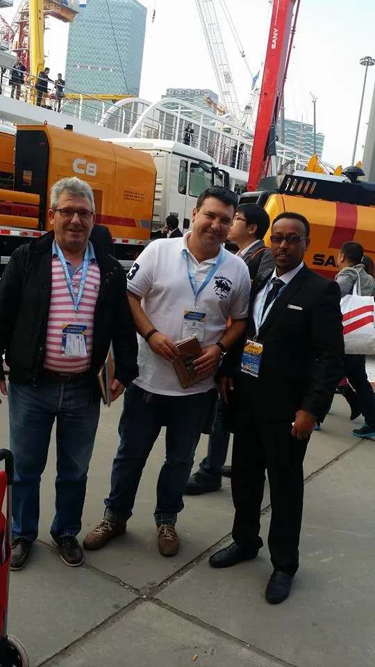 Engineer Kedir Ibrahim with a SANY dealer from Spain at the Bauma International Exhibition in Shanghai, China