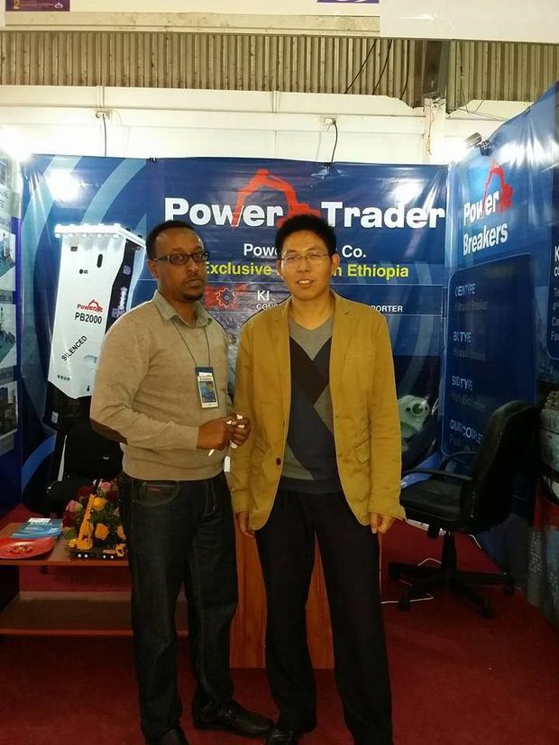 KI representatives with Power Trader partners at a machinery exhibition
