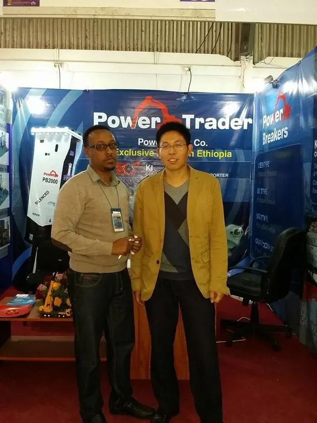 KI representative with the SDLG East Africa Sales Manager at a machinery exhibition